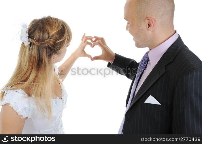 Newlyweds make heart fingers. Isolated on white background