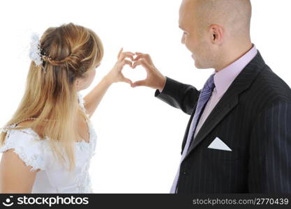 Newlyweds make heart fingers. Isolated on white background