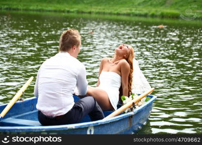 Newlyweds walking paddle boating in the park