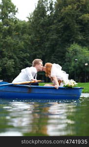 Newlyweds walking paddle boating in the park