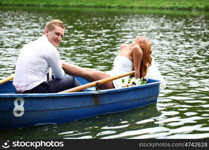 Newlyweds walking paddle boating in the park