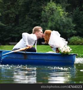 Newlyweds walking paddle boating in the park