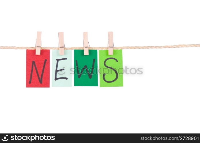 News, Colorful words hang on rope by wooden peg