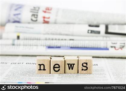 news concept, close-up wooden text wording on newspaper
