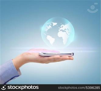 news, technology and environment concept - woman hand with sphere globe