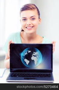news, technology and environment concept - woman with laptop and sphere globe. woman with laptop and sphere globe