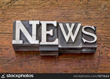 news word in vintage metal type printing blocks over grunge wood, mixed fonts in style and size