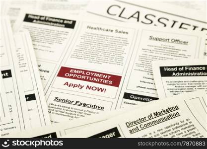 newspaper with advertisements and classifieds ads for vacancy, employment opportunities
