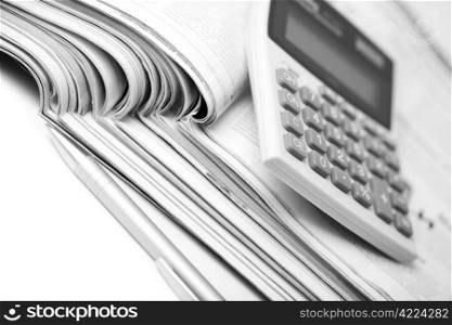 newspapers, pen and calculator. business background