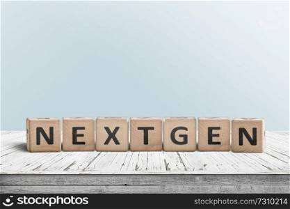 NextGen sign on a plank desk with a cyan wall in the background