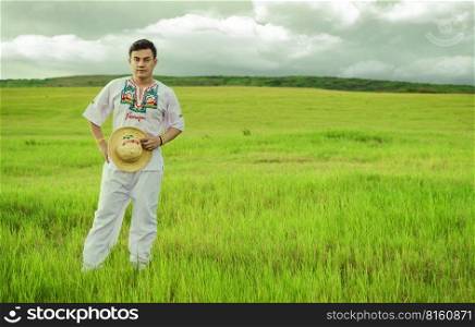 Nicaraguan man in folk costume in the field, Concept of man in Nicaraguan folk costume. Man wearing Central American folk costume, Young man in cultural and folk costume from Nicaragua. Nicaraguan man in folk costume in the field, Man wearing Central American folk costume, Young man in cultural and folk costume from Nicaragua. Concept of man in Nicaraguan folk costume