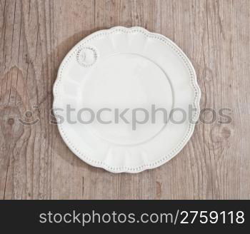 Nice chic vintage dish on wooden background