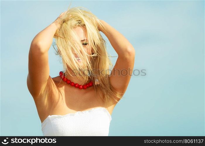 Nice female enjoying nature and beach.. Nature beach outdoors and female. Nice lady enjoying nature and beach. Young woman wearing long white dress and beautiful red necklace.