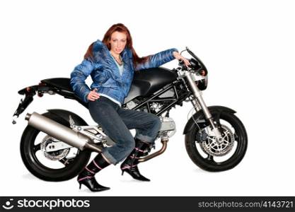 Nice girl stands in sports jacket near by effective motorcycle