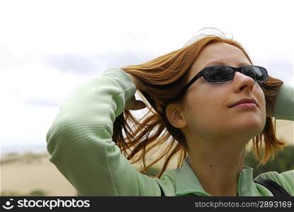 nice girl with sunglasses at dunes