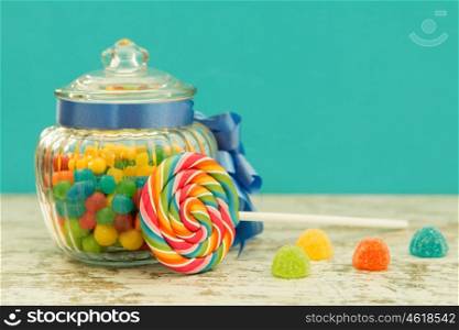 Nice glass container with blue ribbon filled candies