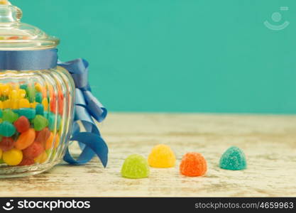 Nice glass container with blue ribbon filled candies