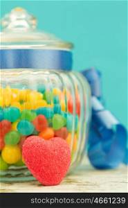 Nice glass container with blue ribbon filled candies
