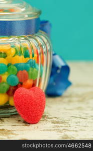 Nice glass container with blue ribbon filled candies