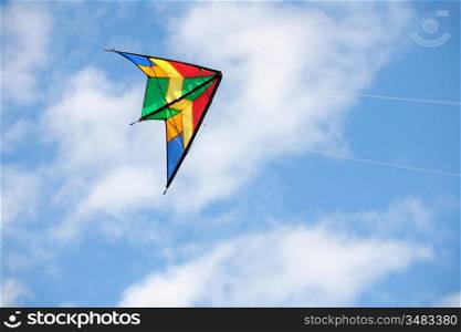 Nice kite flying colors against the blue sky