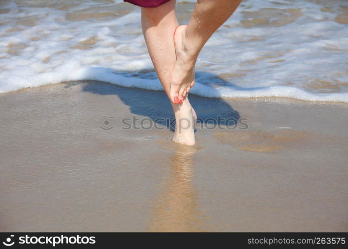 nice legs in water, nice pedicure red nail sand beach