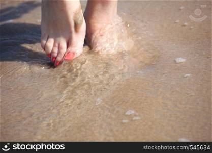 nice legs in water, nice pedicure red nail sand beach