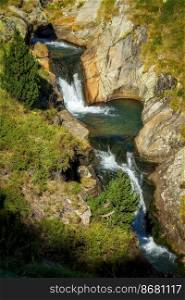 Nice mountain creek waterfalls in a Spanish Pyrenees mountain, near Vall de Nuria valley