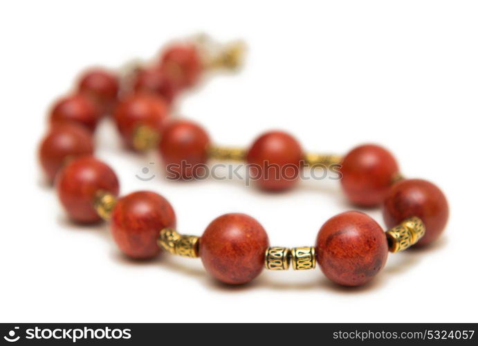 Nice necklace with red beads isolated on white background