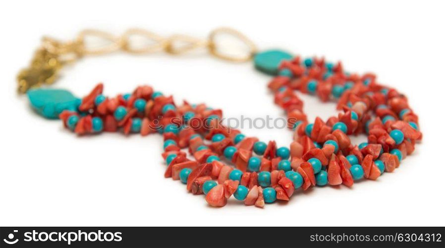 Nice necklace with red beads isolated on white background
