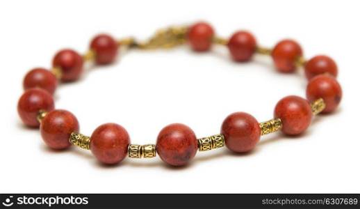 Nice necklace with red beads isolated on white background
