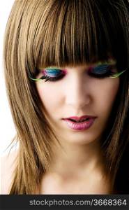 nice of young beautiful girl with colored make up and green long eyelashes