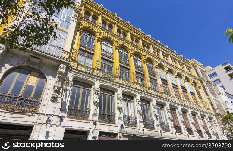 nice old building with highly decorated facade and large windows in Valladolid, Spain