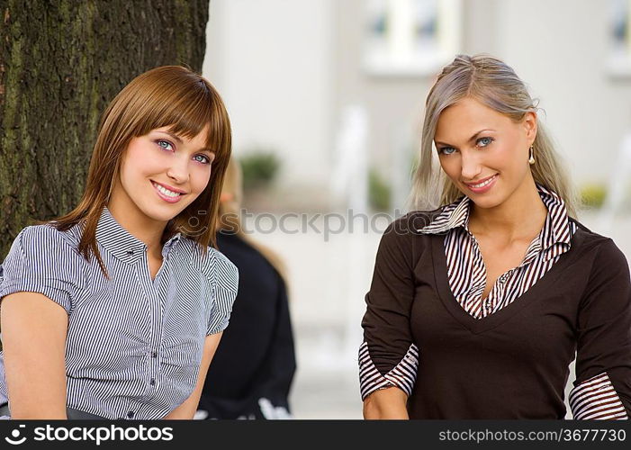 nice outdoor portrait of cute girls looking in camera smiling