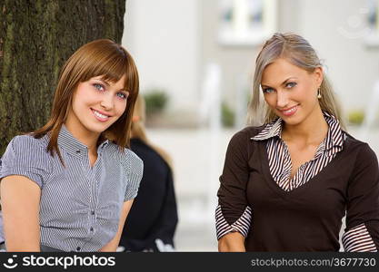 nice outdoor portrait of cute girls looking in camera smiling