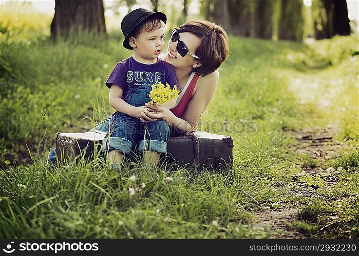 Nice photo of mother and son on the meadow