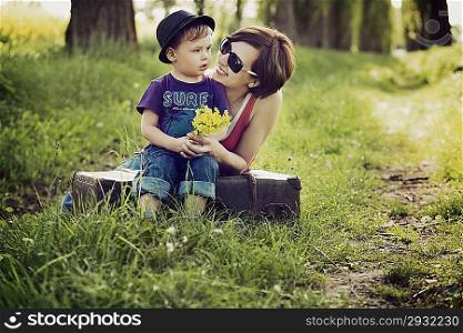 Nice photo of mother and son on the meadow