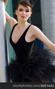 nice portrait of a beautiful young woman dancer outdoor with black tutu