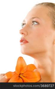 nice portrait of a blond girl with an orange lily and looking up