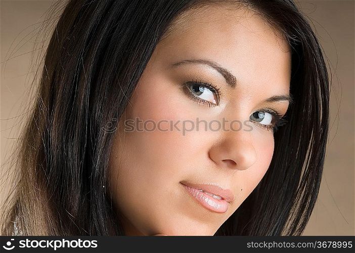 nice portrait of a young and beautiful brunette and stunning eyes