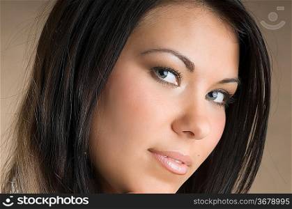 nice portrait of a young and beautiful brunette and stunning eyes