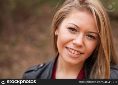 Nice portrait of blonde girl looking at camera