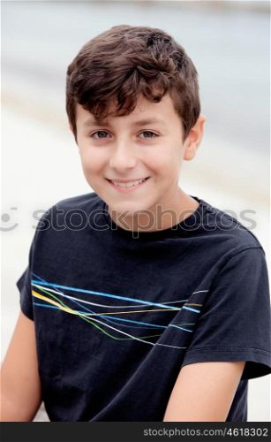 Nice preteen boy smiling with a black t-shirt