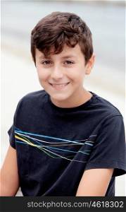 Nice preteen boy smiling with a black t-shirt
