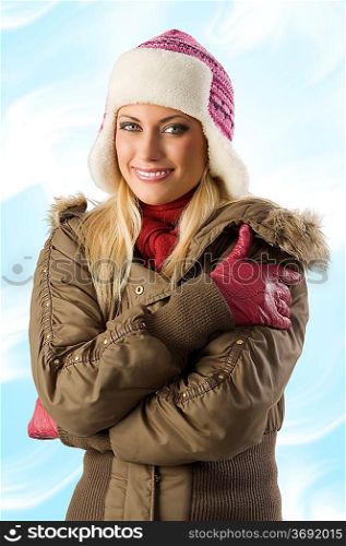 nice shot of beautiful blond girl in winter breakwind jacket scarf gloves and pink hat