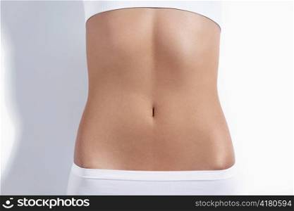Nice tight belly on a white background