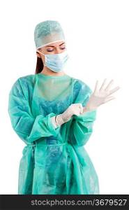 nice woman in green surgery dress with cap mask and gloves
