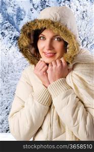 nice young woman with a white winter jacket with hood with fur on head