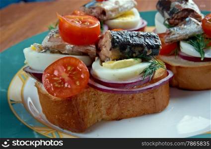 Nicoise toast - sandwiches with eggs, fish and cherry tomatoes