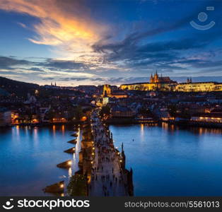 Night aerial view of Prague castle and Charles Bridge over Vltava river in Prague, Czech Republic. Prague, Czech Republic