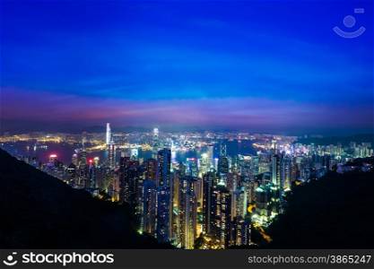 Night aerial view panorama of Hong Kong skyline and Victoria Harbor. Travel destinations
